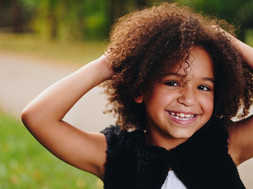 Girl outdoors and smiling